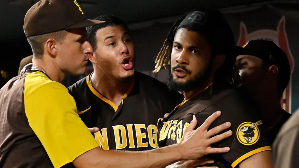 machado's teammates and padres tries to cool him down.