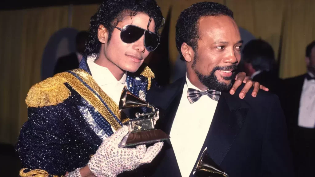 Quincy Jones: His Life, Love Affairs, and 20 records you never knew he produced. quincy jones taking award with michael jackson